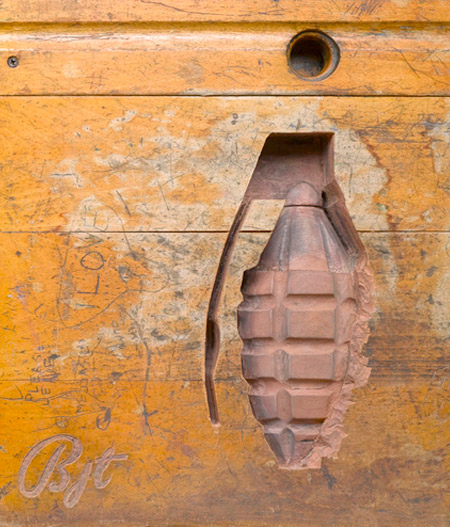 Weapon Carved into a Desk