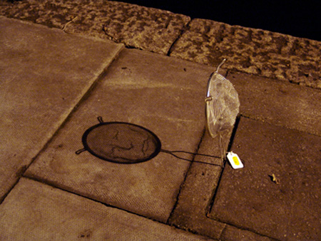 Face by Isaac Cordal