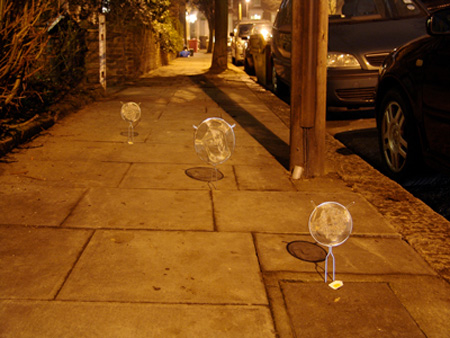 Faces by Isaac Cordal
