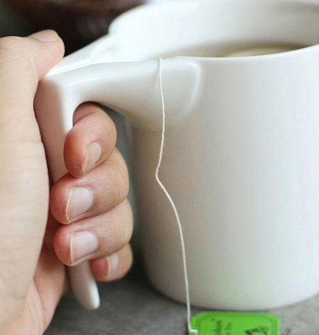 This mug i found with a tea bag holder. : r/mildlyinteresting